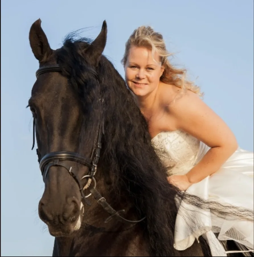 Tamara Blokker with a Friesian horse