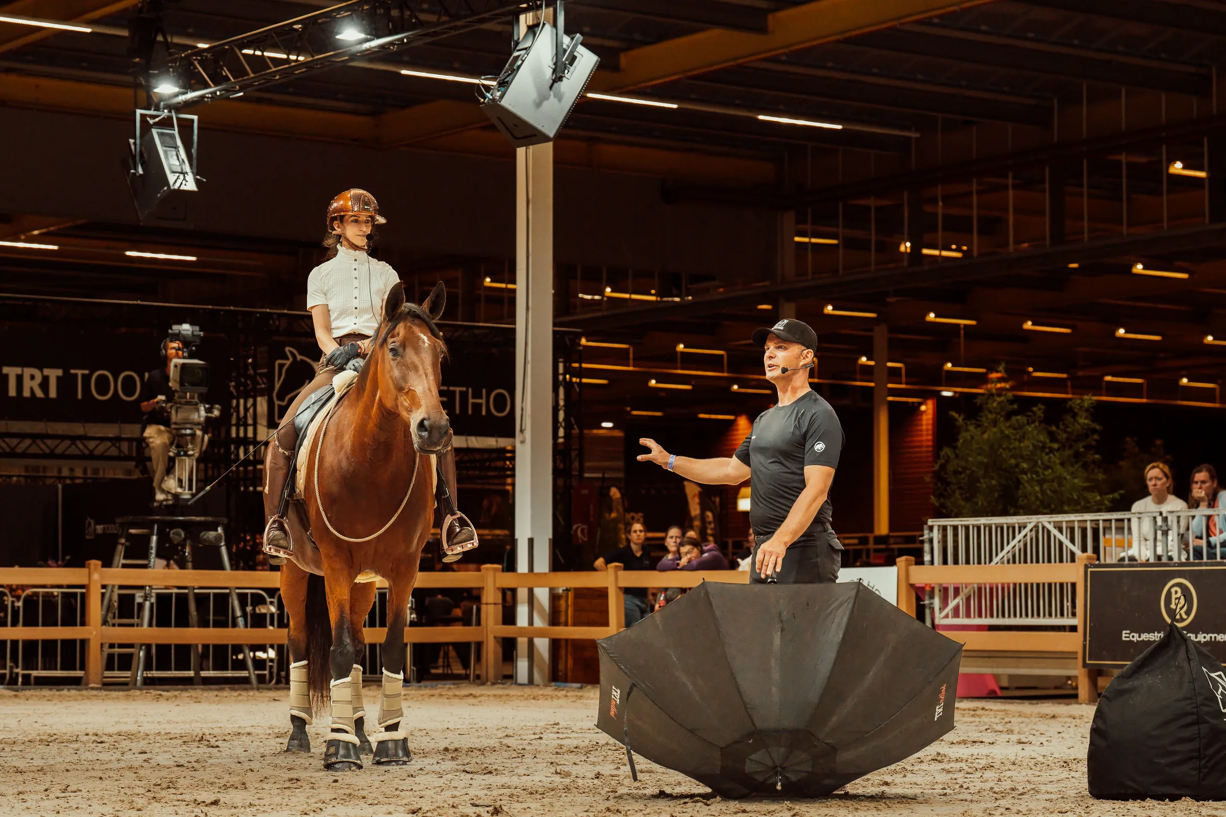 Alizée Froment riding while Tristan Tucker teaches at Horse Event 2026